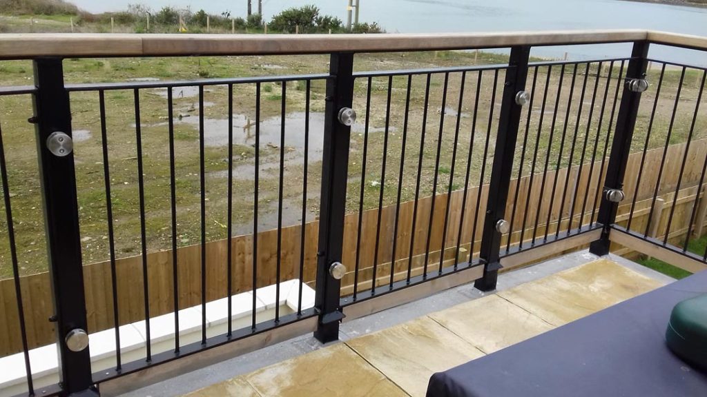 Patio With Steel Balustrade And Wooden Hand Rail